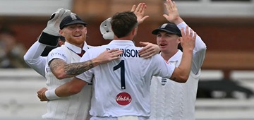 Robinson's Double Blow Puts England on Top Amid Rain Interruptions